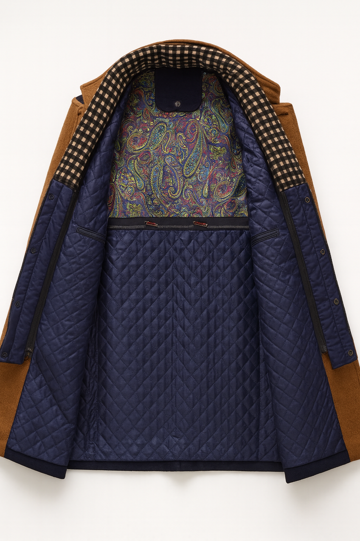Detail view of quilted interior panel with paisley print panel and interior zip pouches