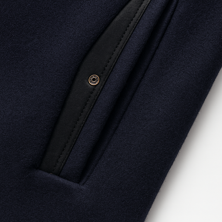 Detail view of welt pocket with stitched border and snap detail