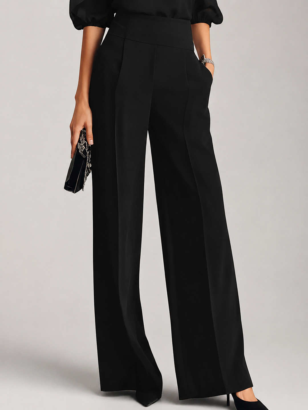 Detail view of banded waist, side pocket and wide legs