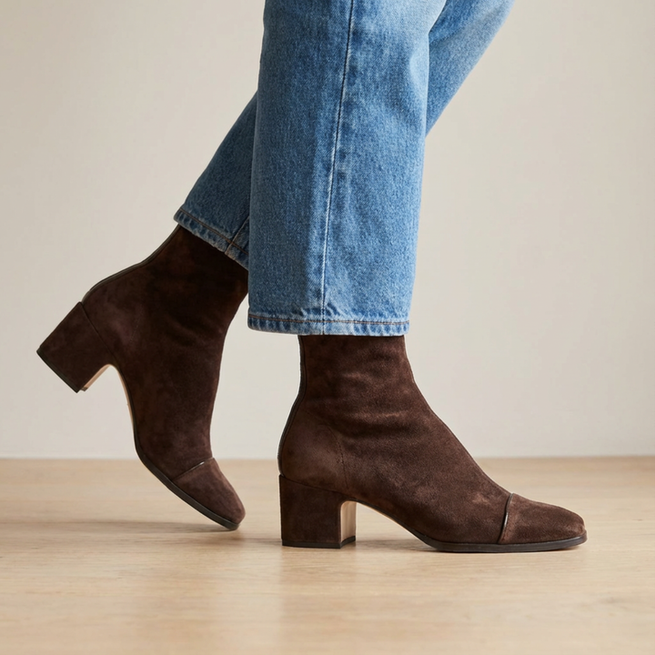 Side view showing upper, toe cap and block heel