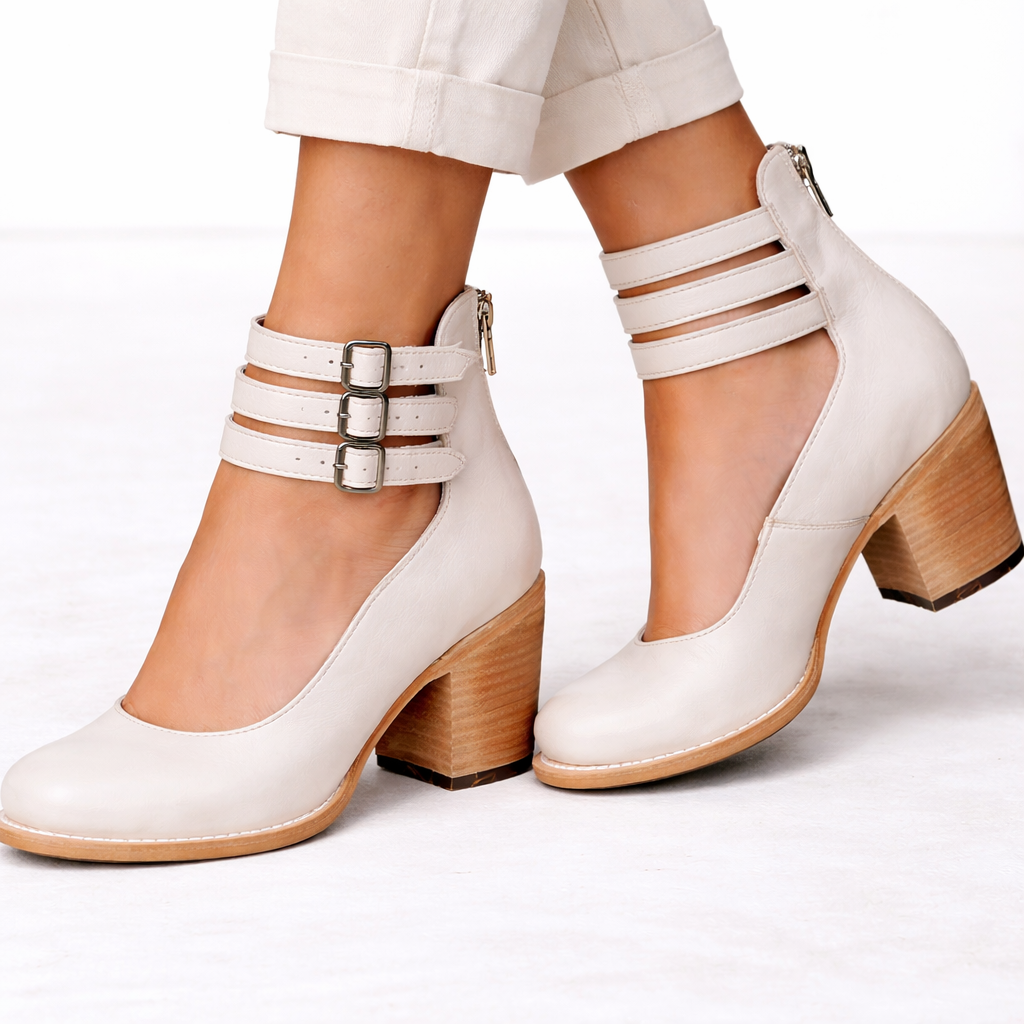 Front view of triple ankle straps with buckles and back zip, white