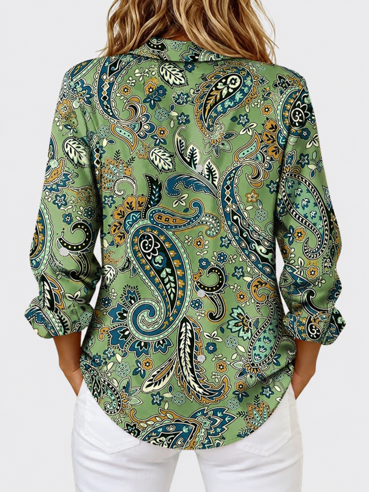 Back view showing shirt collar, long sleeves and curved hem