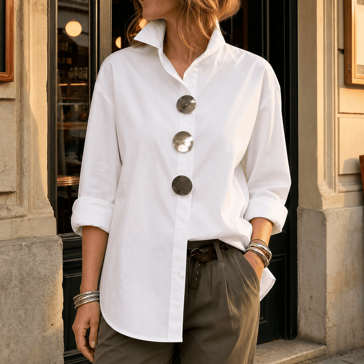 Front view showing stand collar, button front and long sleeves, white