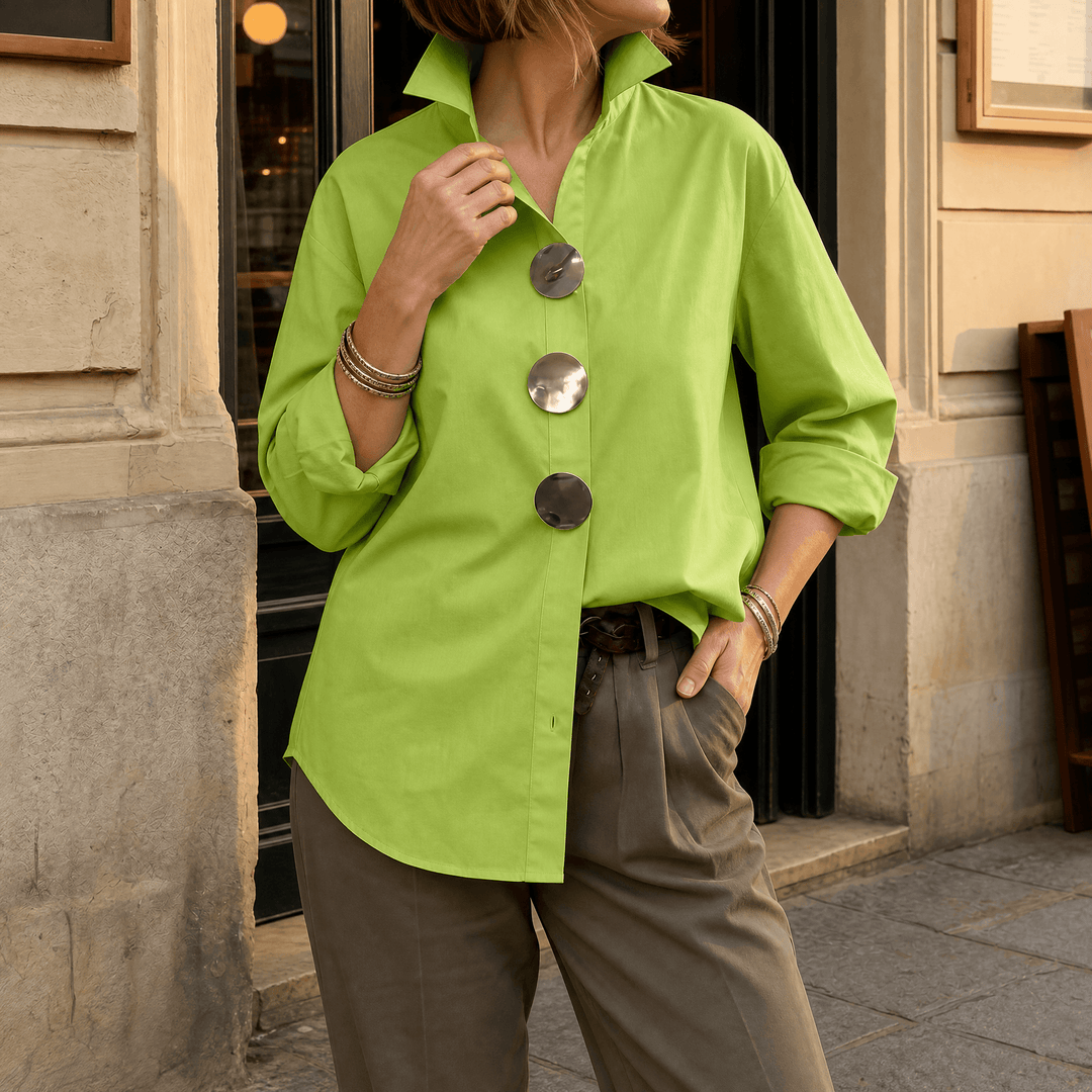 Front view showing stand collar, button front and asymmetric hem, green