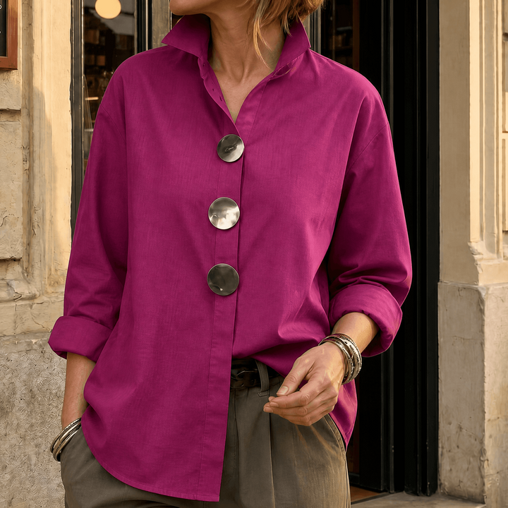 Front view showing stand collar, button front and long sleeves, fuchsia