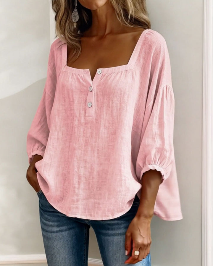 Front view showing square neckline and gathered cuffs