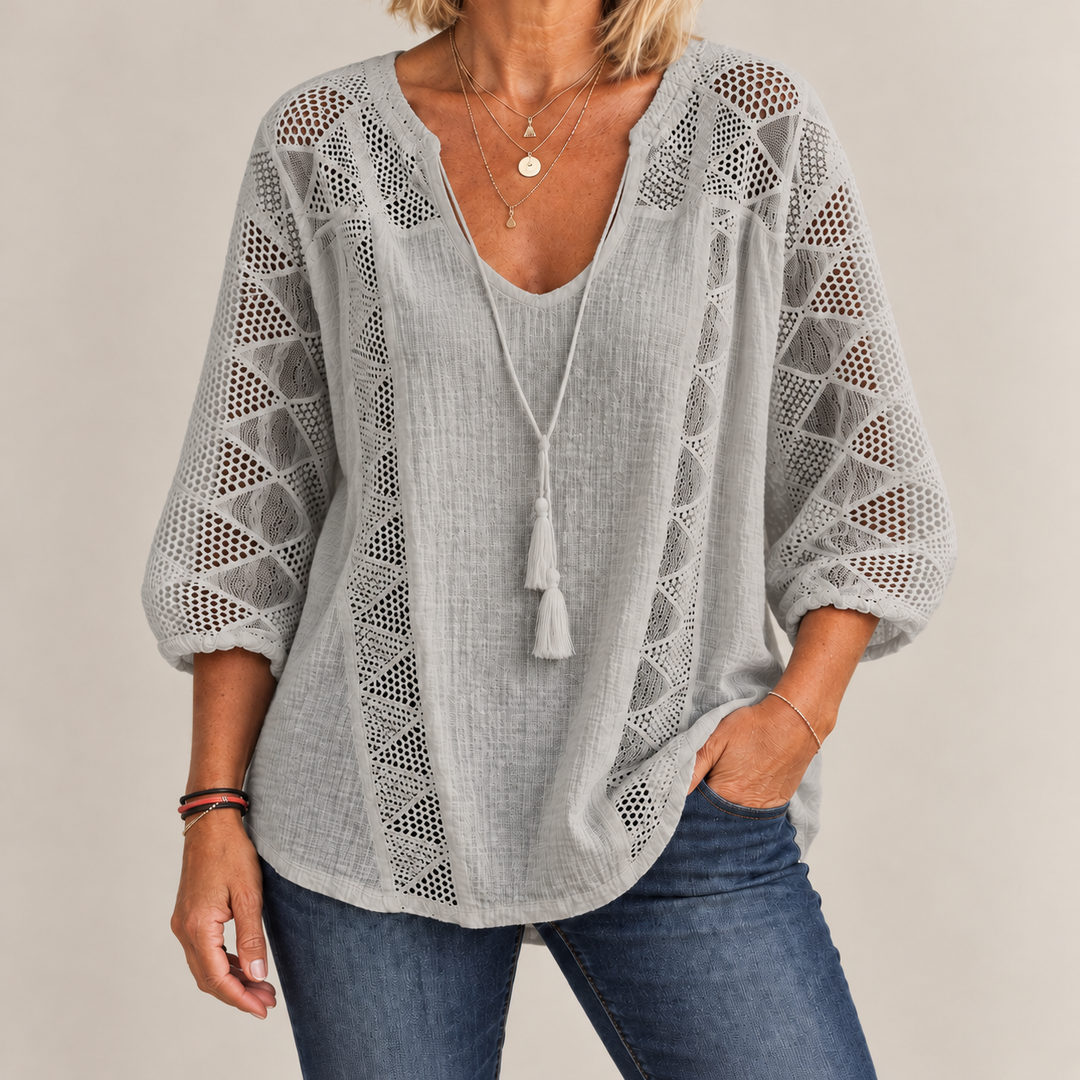Front view showing crochet front panels and curved shirttail hem, grey