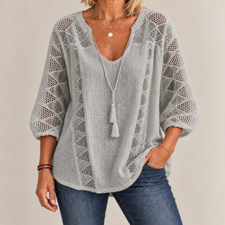 Front view showing crochet front panels and curved shirttail hem, grey