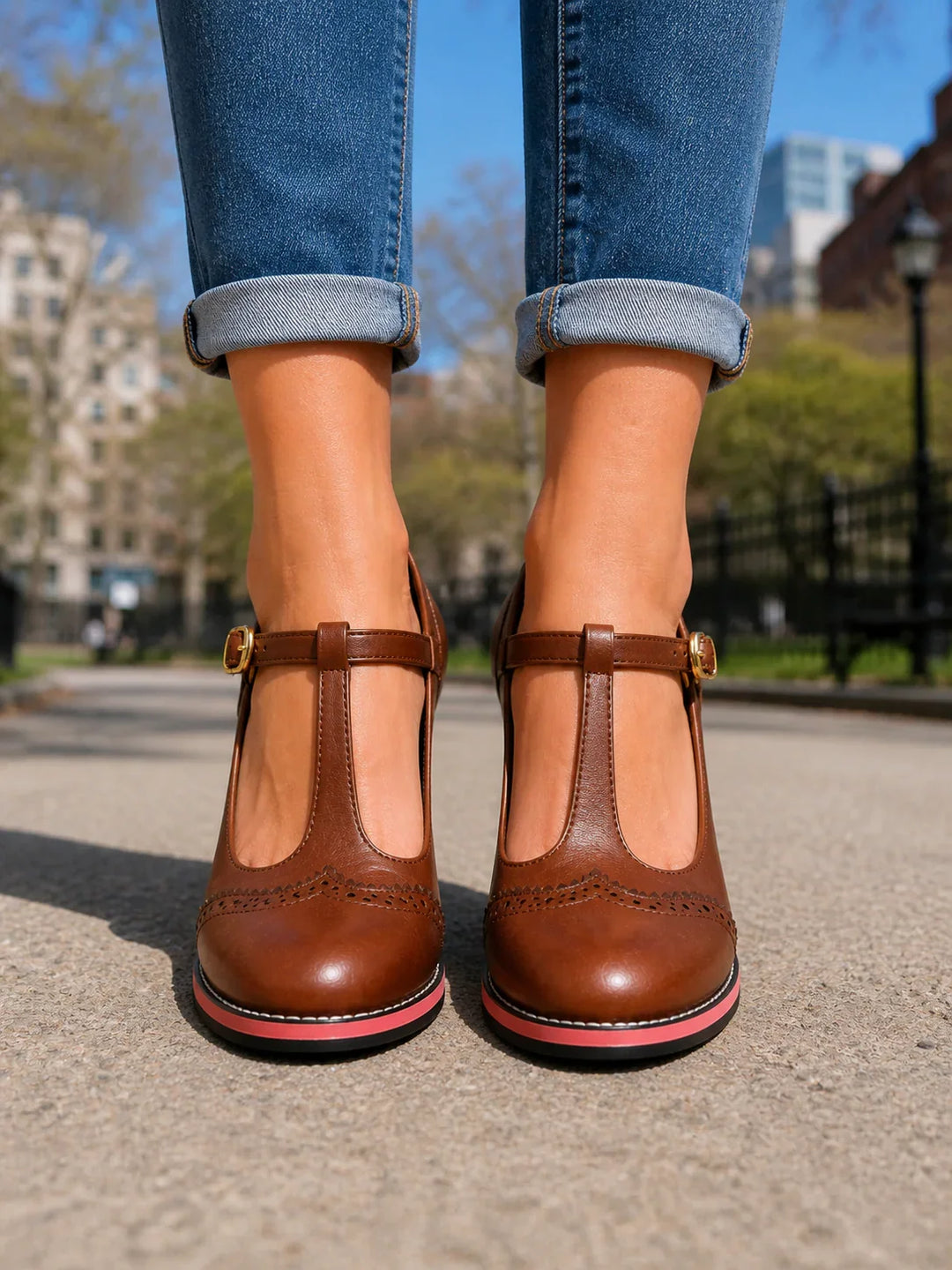 Front view showing t-bar strap, buckle and brogue toe