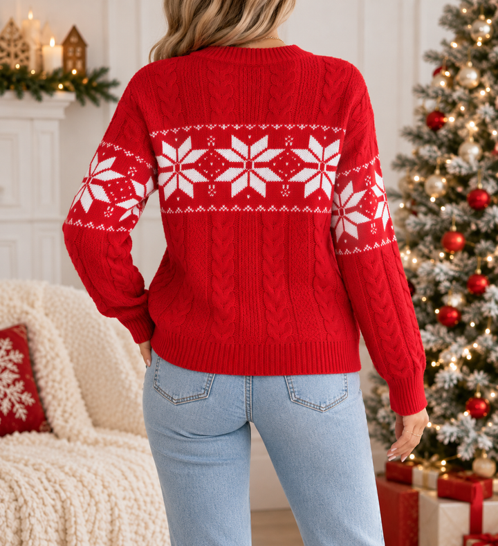 Back view showing round neckline, long sleeves and snowflake pattern across back and sleeves