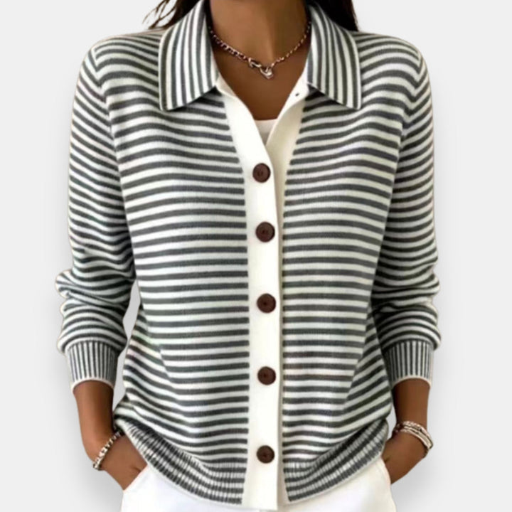 Front view showing shirt collar, long sleeves and button placket, black
