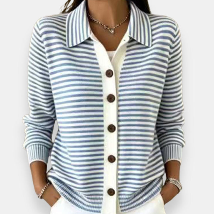 Front view showing shirt collar, banded cuffs and hip-length hem, light blue