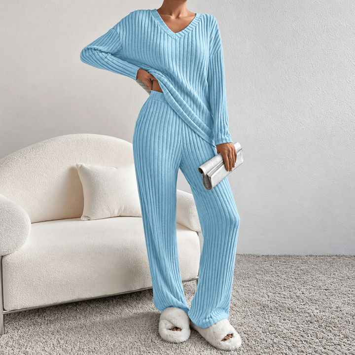Front view showing v-neckline, long sleeves and wide legs, blue