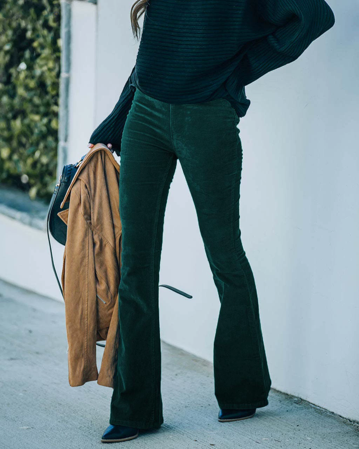 Side view showing flared legs and full-length hem, green
