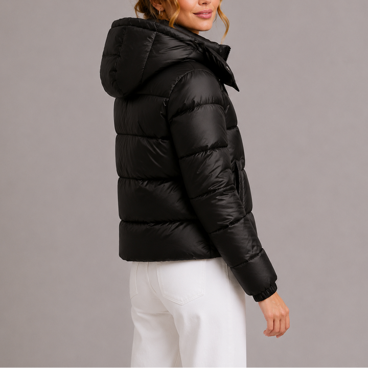 Back view showing hood and quilted back with banded cuffs