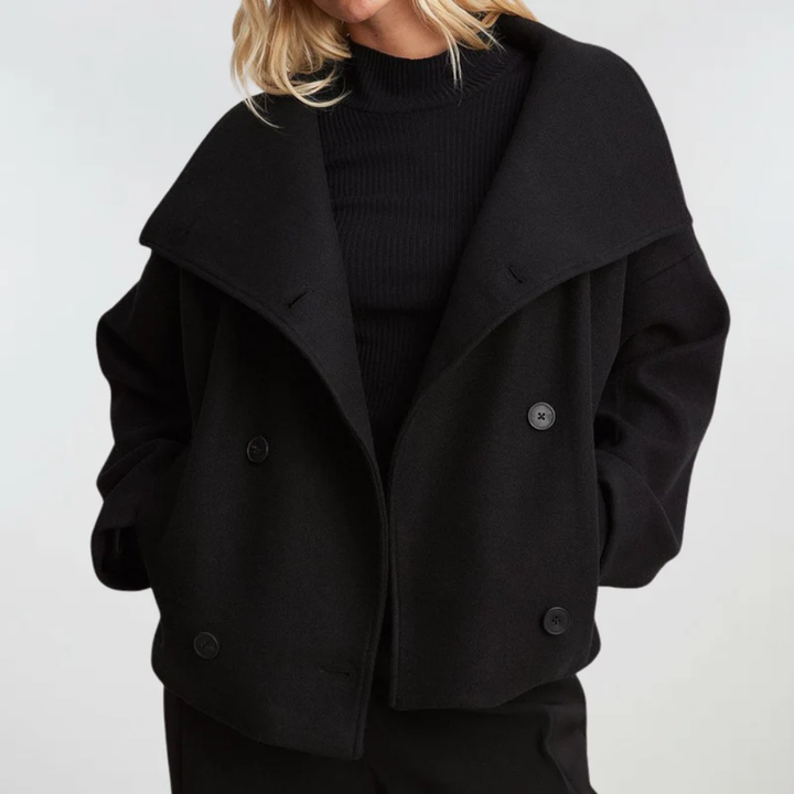Front view showing wide lapels, collared neckline and double-breasted buttons, black