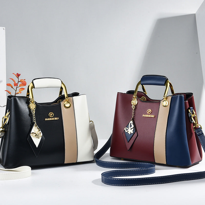 Front view showing two bags with top handles and colour-block bodies