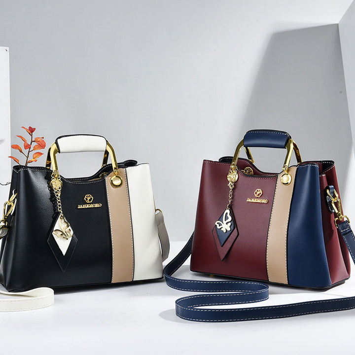 Front view showing two bags with top handles and colour-block bodies