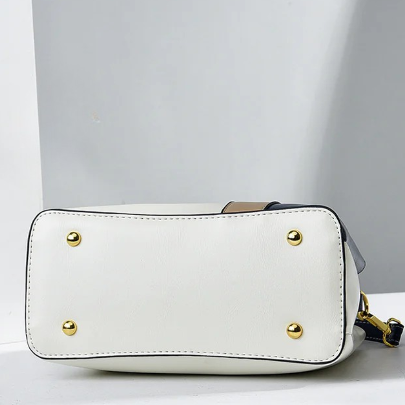 Front view showing top handle, butterfly charm and colour-block body
