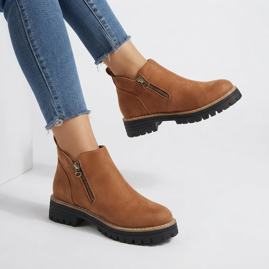 Side zip fastening close-up on the ankle boots