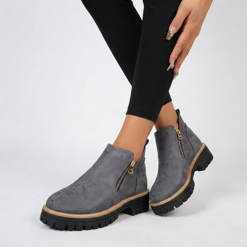 Flat tread sole of the heeled ankle boots