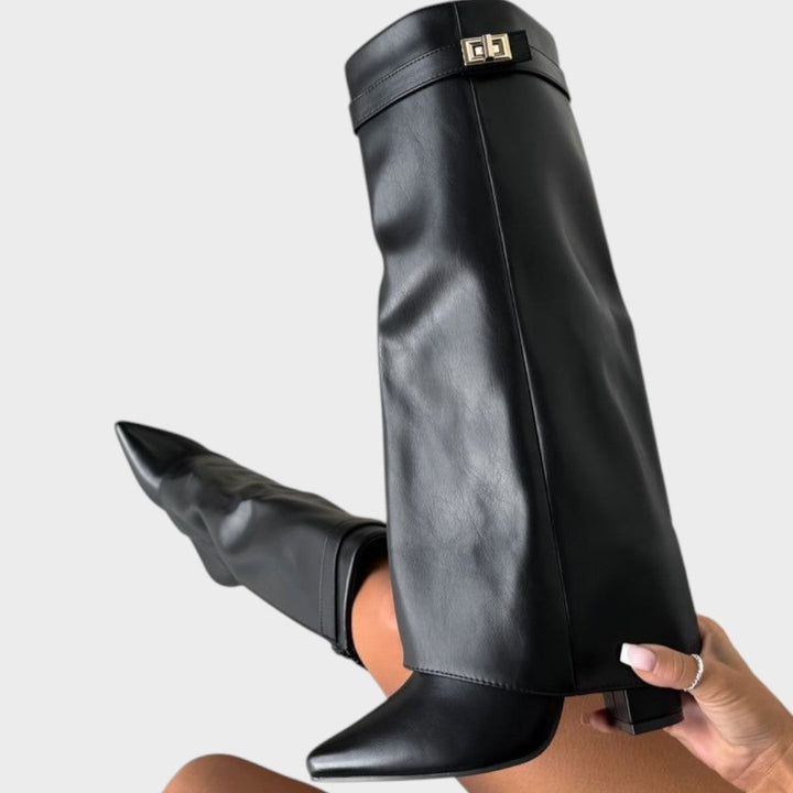 Side view of fold-over shaft boot with twist-lock strap and pointed toe