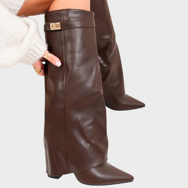 Front view of fold-over shaft boot with twist-lock strap and pointed toe, brown