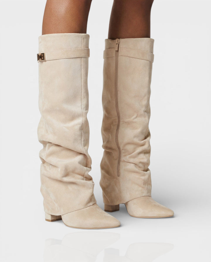 Front view of foldover shaft, turn-lock strap, pointed toe and block heel, beige