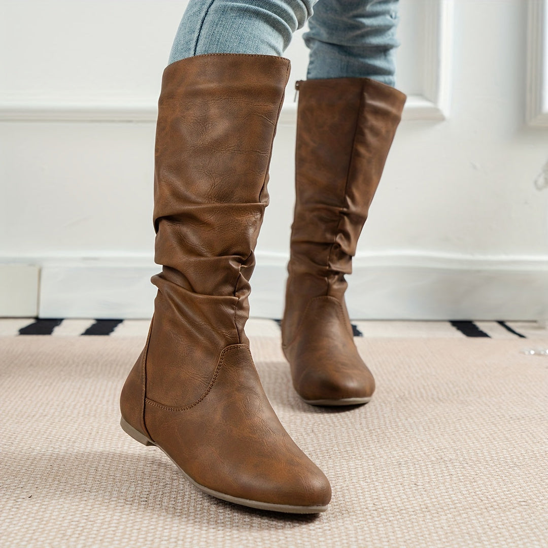 Detail of flat sole on light brown boot