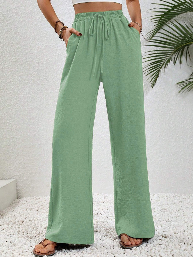 Front view of side pockets and wide legs, mint green