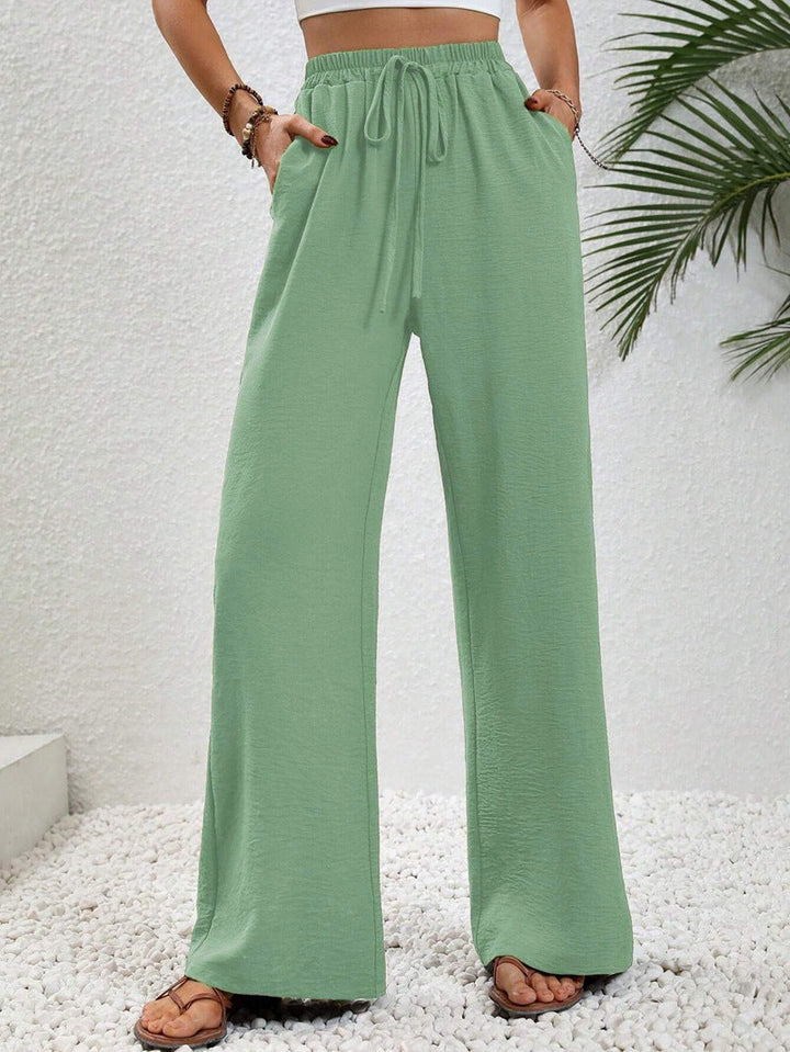 Front view of side pockets and wide legs, mint green