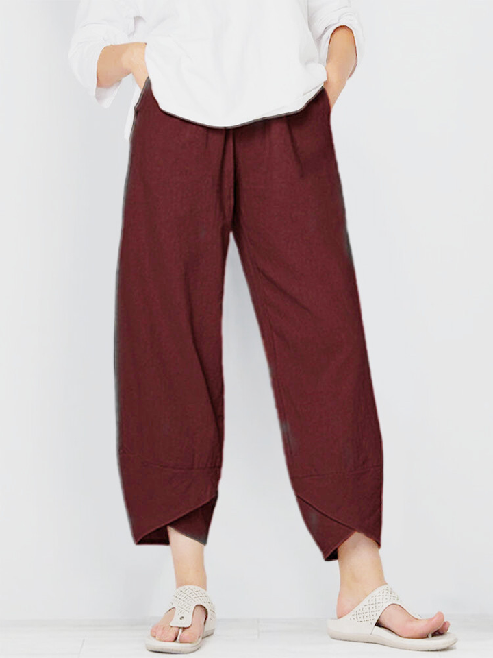 Front view of wide legs and overlapping panel hem, wine red