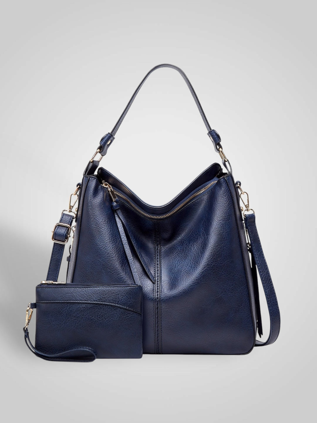 Front view showing top handle, crossbody strap, top zip closure and matching pouch, blue