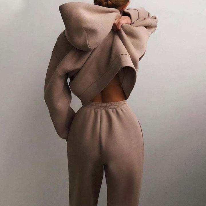 Back view showing hood, dropped shoulder seams and banded waist of trousers