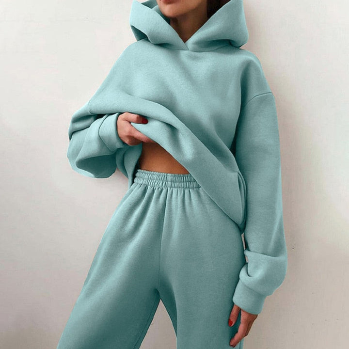 Side view showing hood, long sleeves and banded waist of trousers