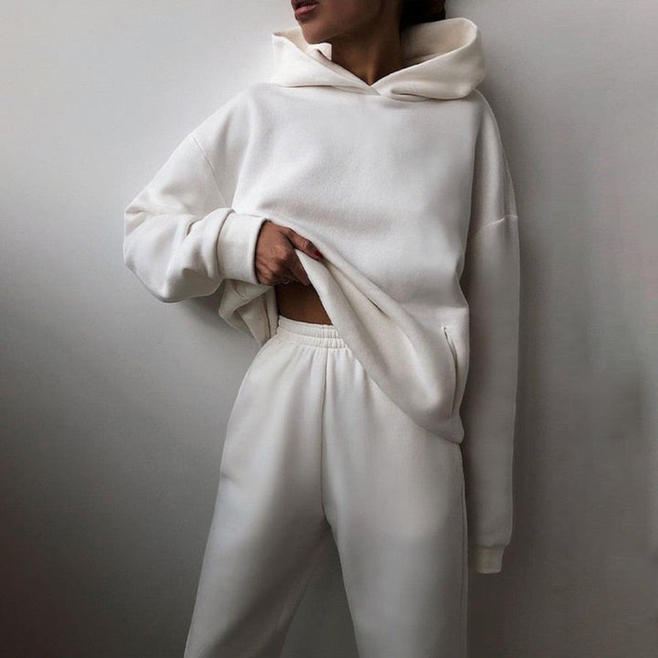 Side view showing hood, long sleeves, side pocket and banded waist of trousers