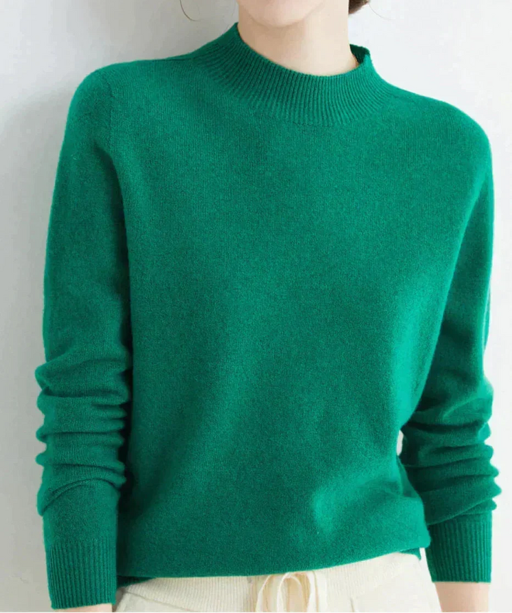 Front view showing mock neckline and ribbed cuffs, dark green
