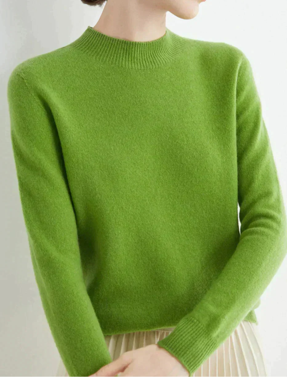 Front view showing mock neckline and long sleeves, green
