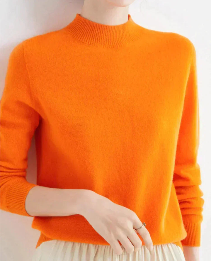 Front view showing mock neckline and ribbed cuffs, orange