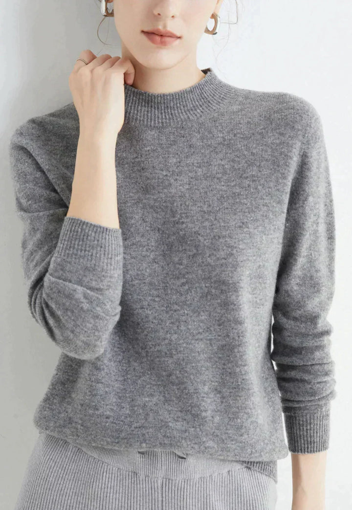 Front view showing mock neckline and ribbed cuffs, grey