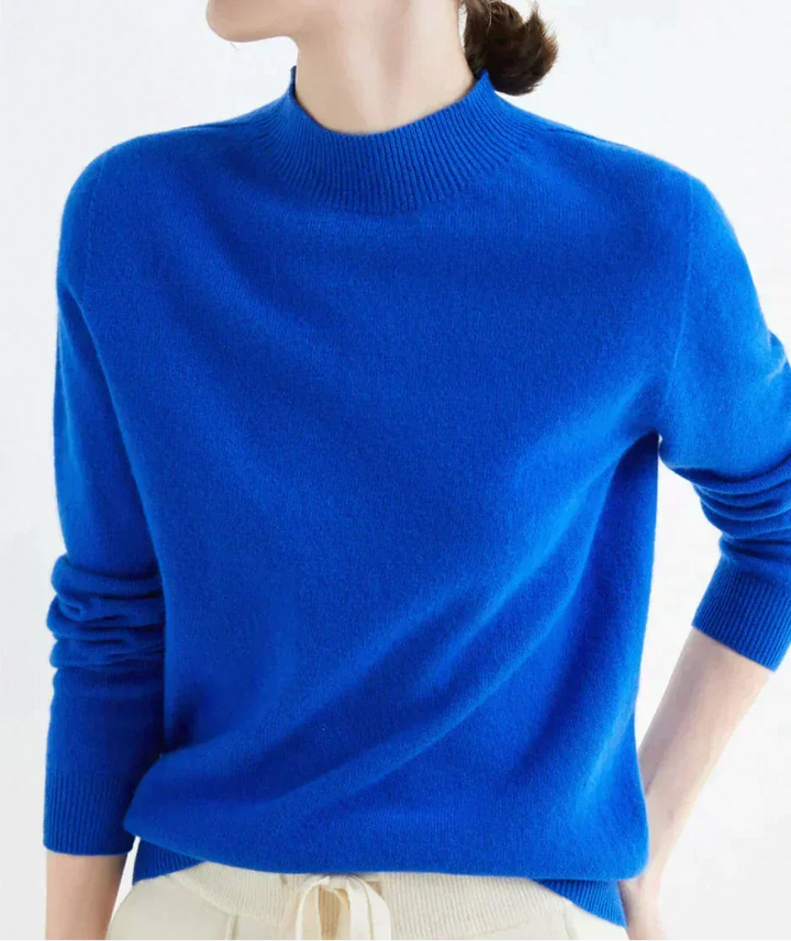 Front view showing mock neckline and long sleeves, blue