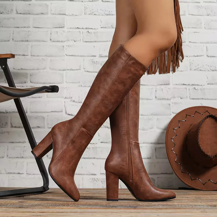 Side view of pointed toe, block heel and knee-length upper, brown