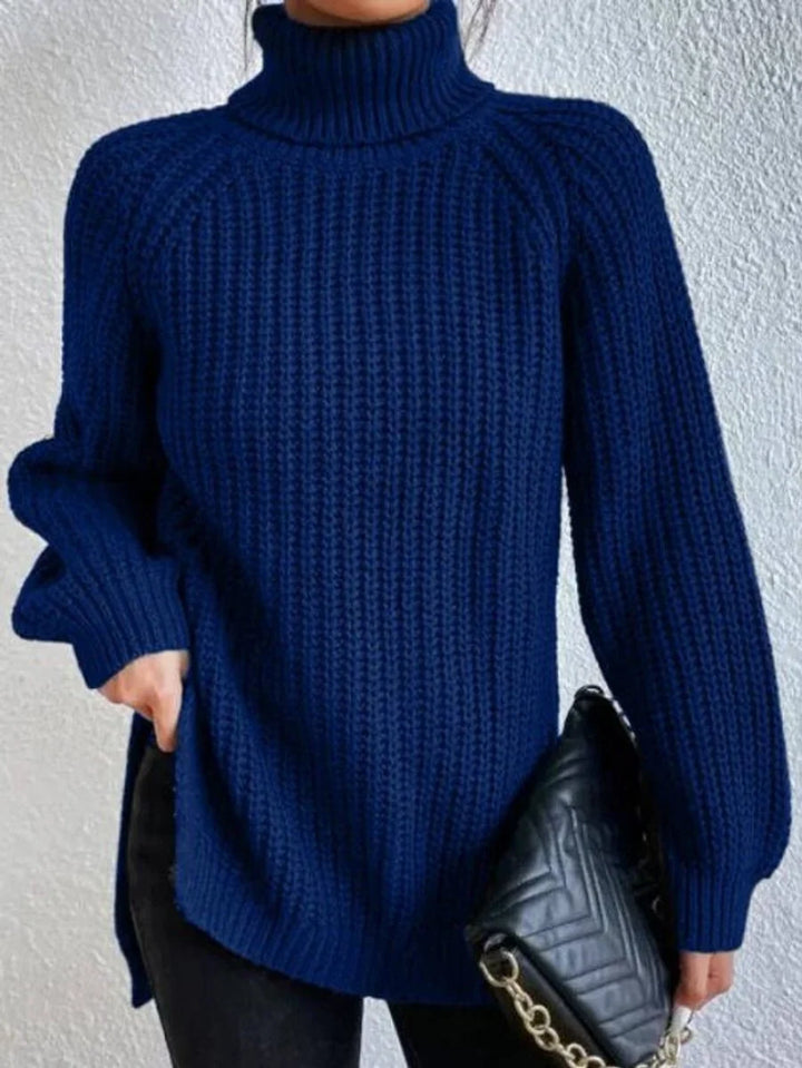 Front view showing turtleneck and hip-length hem, navy blue