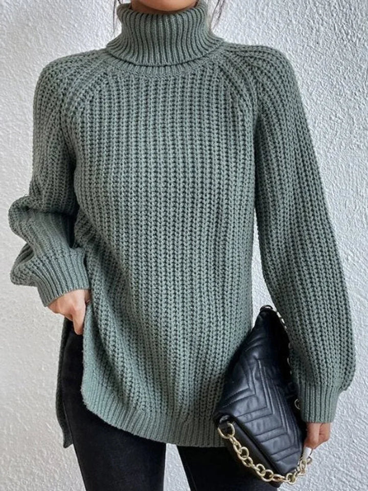 Front view showing turtleneck and side slit, green