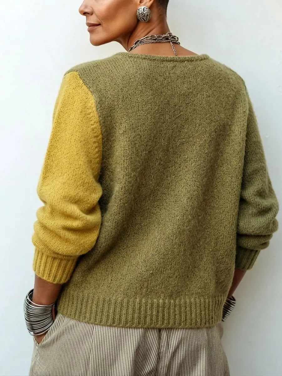 Back view showing dropped shoulder seams and banded hem