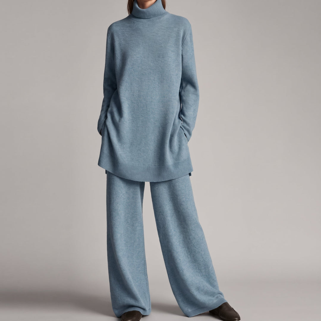 Front view showing turtleneck, side pockets and wide legs, blue