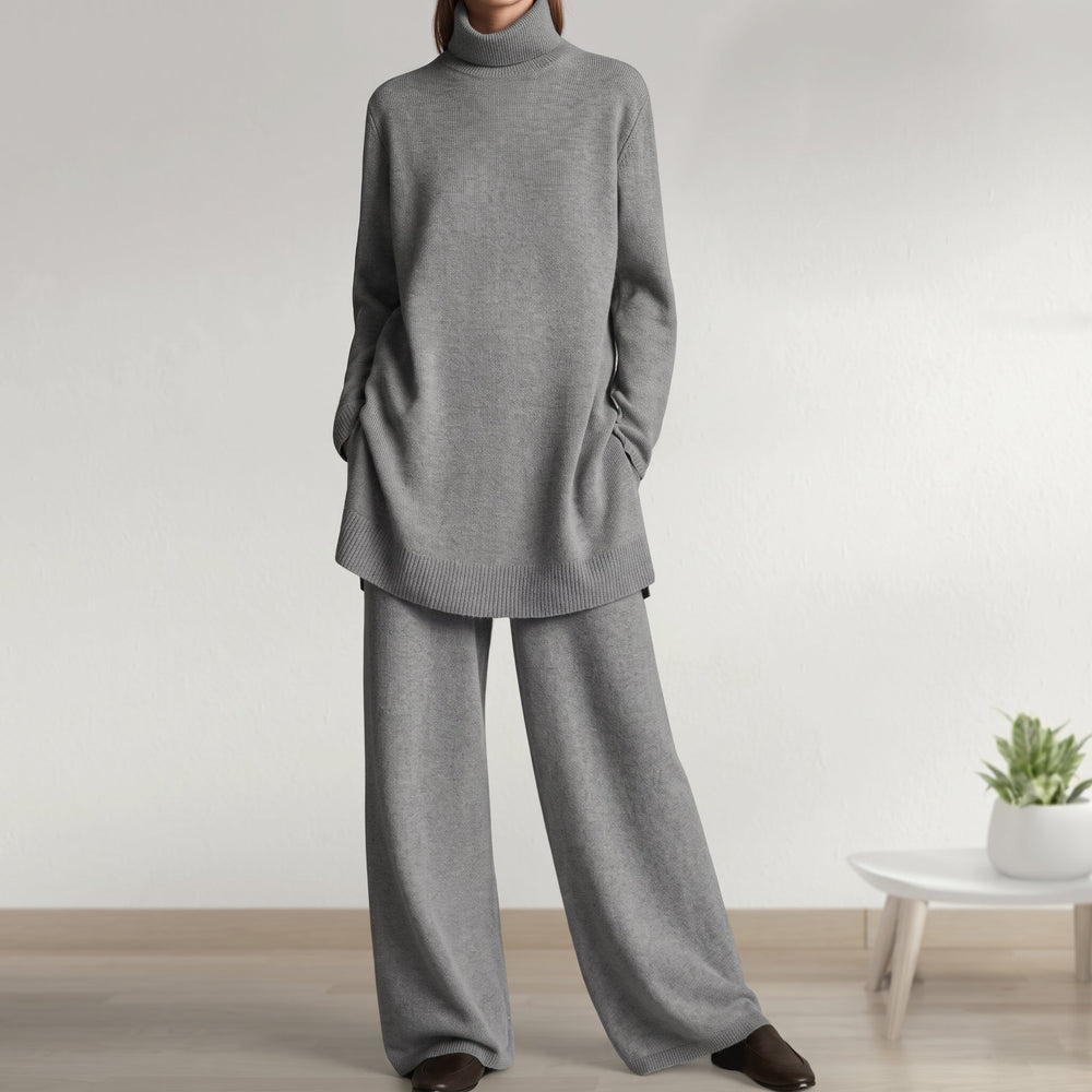 Front view of turtleneck jumper with banded hem and wide-leg trousers, grey