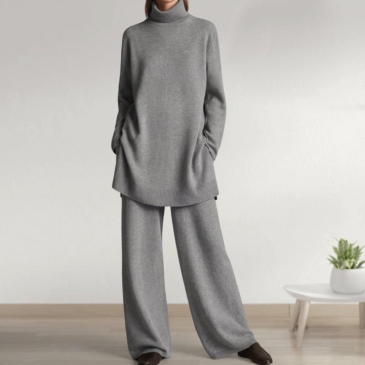 Front view of turtleneck jumper with banded hem and wide-leg trousers, grey