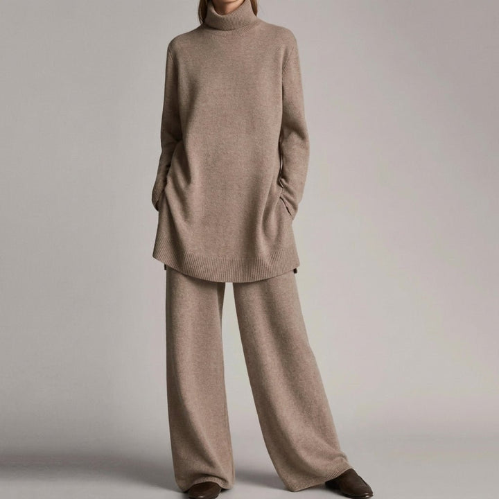 Front view showing turtleneck, side pockets, banded hem and wide legs, khaki
