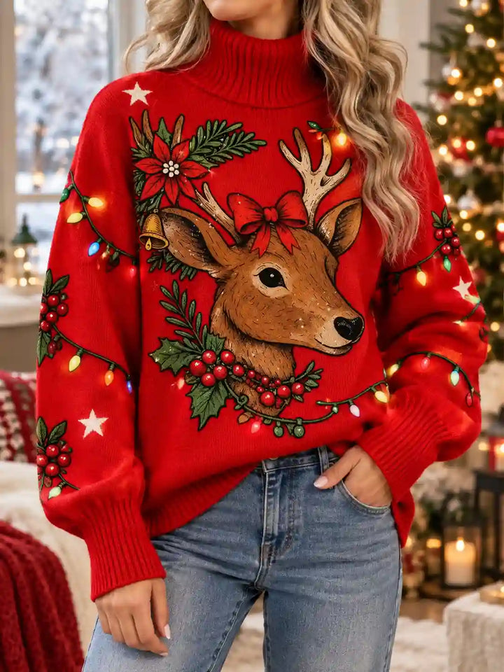 A woman wearing a festive red Christmas sweater with a large deer graphic, holly leaves, pine branches, and glowing holiday lights, paired with blue jeans in a decorated indoor holiday setting.